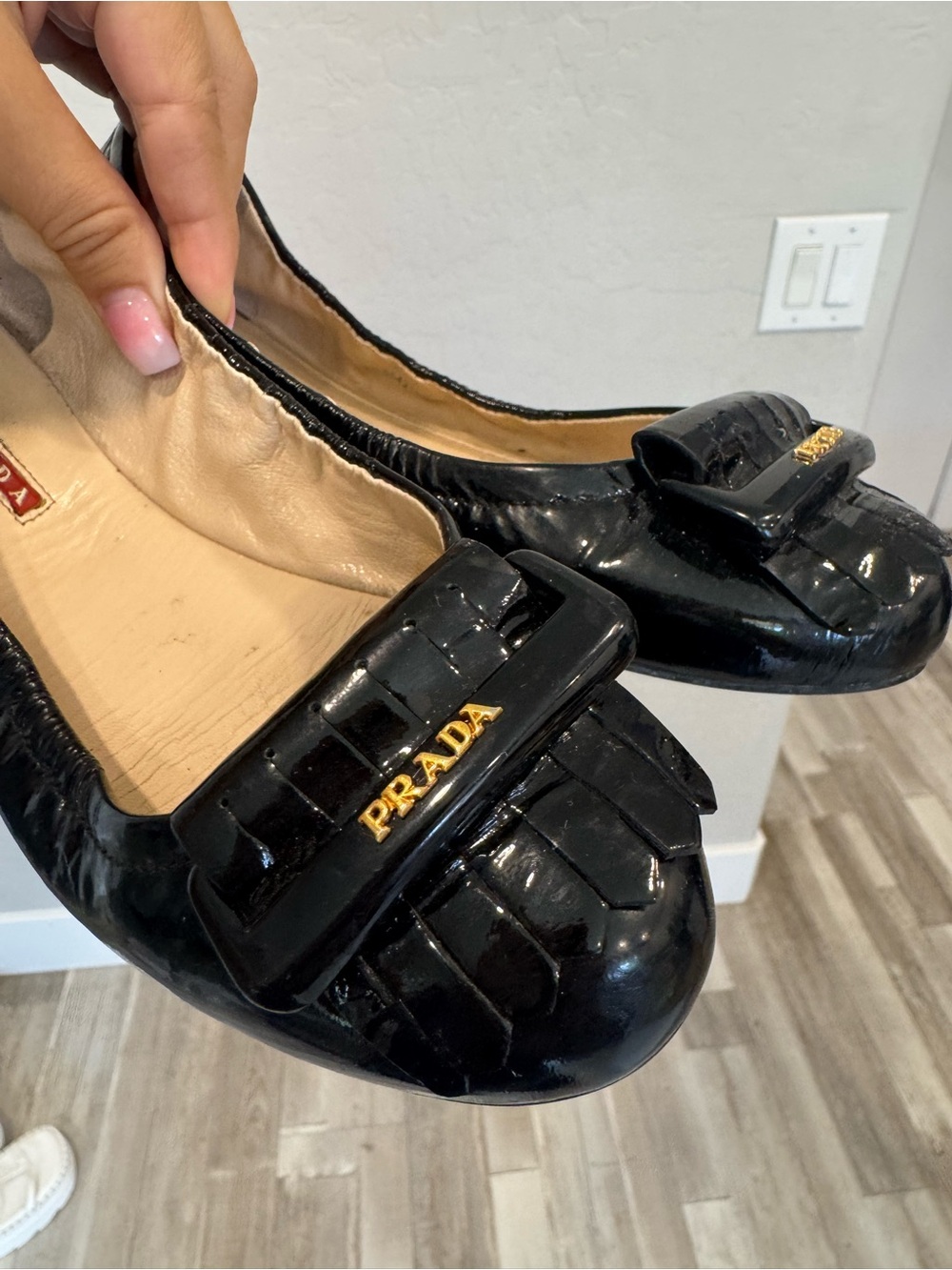 Prada Black Patent Leather Ballet Flats with Gold Logo Plaque
